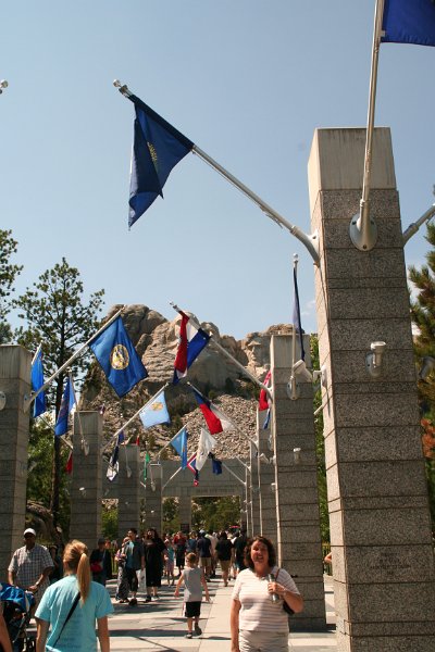 Trip (241).JPG - Sharon standing under the Kentucky (her birth state) flag at Mount Rushmore National Memorial